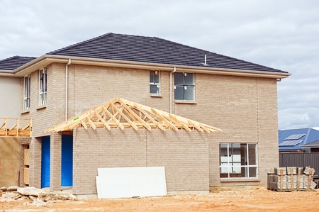 10316213 New Home Currently Under Construction Against Blue Sky